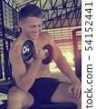 Handsome man doing the exercise with dumbbells, 54152441