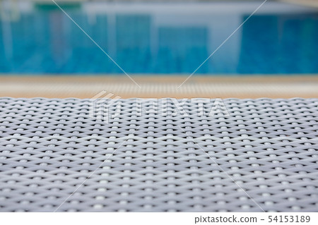 wicker rattan pool sun bed deckchair at swimming pool 54153189