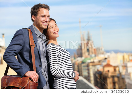 Happy romantic couple looking at view of Barcelona Happy romantic couple looking at view of Barcelona 54155050