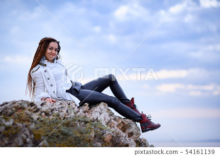 dreadlocks fashionable girl dressed in white dreadlocks fashionable girl dressed in white 54161139