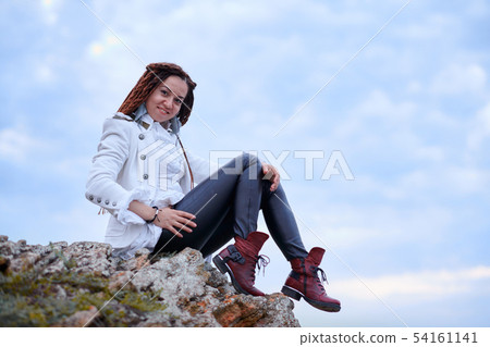 dreadlocks fashionable girl dressed in white dreadlocks fashionable girl dressed in white 54161141