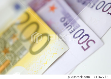 Paper euro 500 and 200 cash lie on the table 54162718