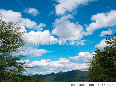 Mountain blue sky and clouds Mountain blue sky and clouds 54162992