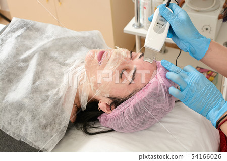 Young woman in beauty salon doing ultrasound Young woman in beauty salon doing ultrasound 54166026