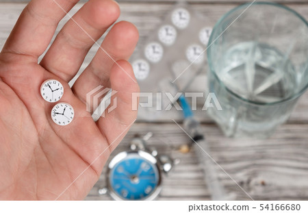Time to take medicine concept. Hand holding pills Time to take medicine concept. Hand holding pills 54166680