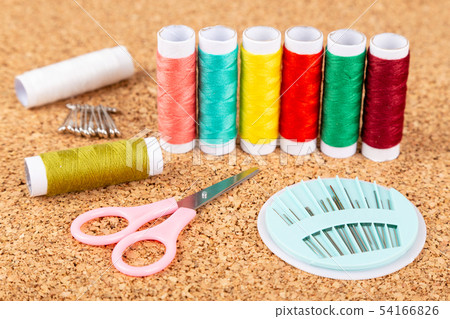 Sewing kit with colorful spools of threads and Sewing kit with colorful spools of threads and 54166826
