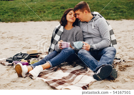 Beautiful couple spend time in a summer park 54167501