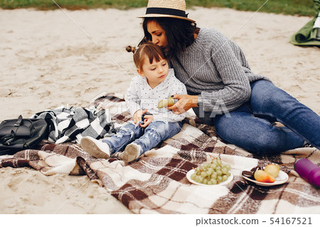 Mother with daughter playing in a summer park Mother with daughter playing in a summer park 54167521