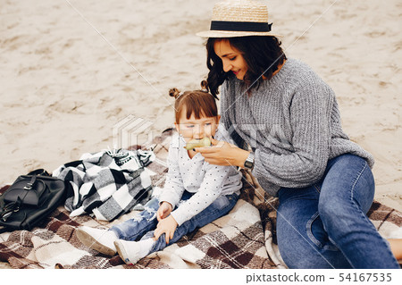 Mother with daughter playing in a summer park 54167535