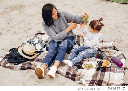 Mother with daughter playing in a summer park 54167547