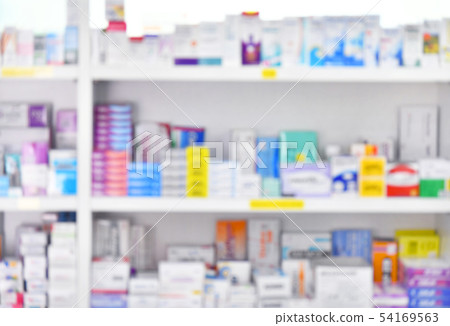 Medicine on shelves in Pharmacy,blurred background 54169563