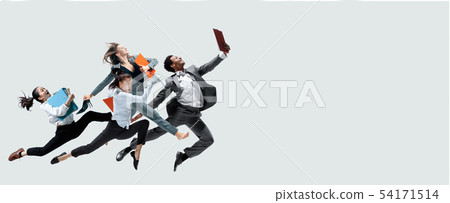 Office workers jumping isolated on studio background 54171514