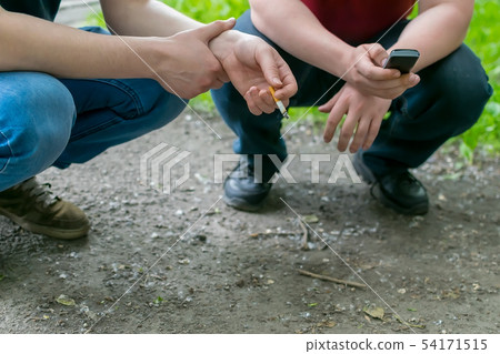 yard teenagers, hooligans, squatting on the street 54171515