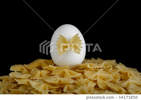 Pasta bows on a black background 54173850