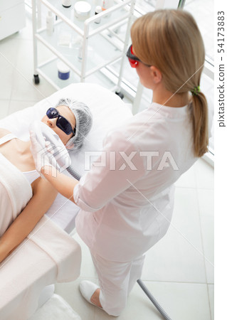 Top view of a skilled experienced dermatologist Top view of a skilled experienced dermatologist 54173883