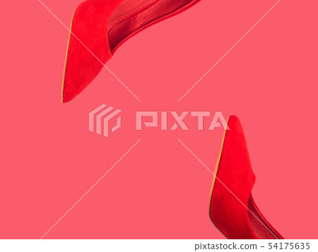 Red female pumps isolated on coral pink 54175635