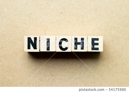 Letter block in word niche on wood background 54175980