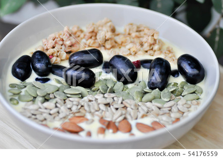 smoothie bowl,mango yogurt with fruit and almond 54176559