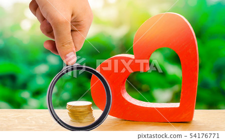 Red wooden heart and money. The concept of saving 54176771