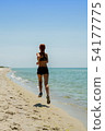girl running seaside 54177775