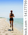 girl running seaside 54177799