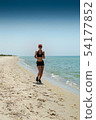 girl running seaside 54177852