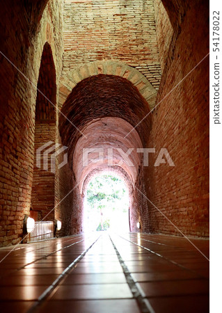 The old tunnel with a light in the end at Wat The old tunnel with a light in the end at Wat 54178022