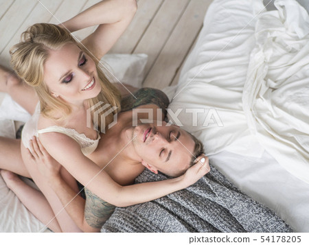 Beautiful passionate couple is having sex on bed Beautiful passionate couple is having sex on bed 54178205