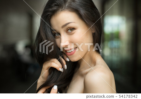 shy smiley woman in park. close up portrait of a woman. Natural beauty concept. shy smiley woman in park. close up portrait of a woman. Natural beauty concept. 54178342
