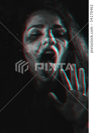 crazy girl portrait with tongue sticking out with glitch effect through glass with rain drops 54178462