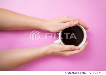 Flatlay with woman hands holding coffee mug. 54178746