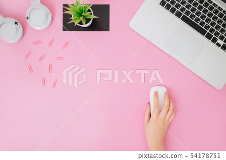Flatlay with women's office desk on a pink background. Flatlay with women's office desk on a pink background. 54178751