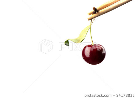 Chopsticks with ripe cherries over white 54178835