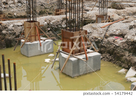 Pile cap and column stump under construction 54179442