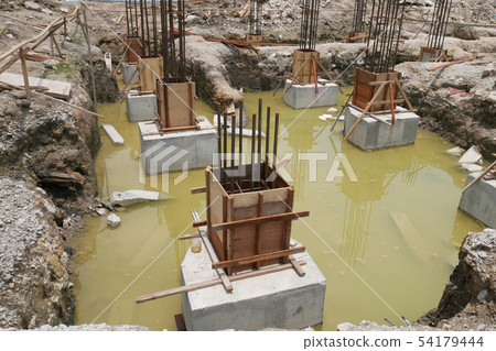 Pile cap and column stump under construction 54179444