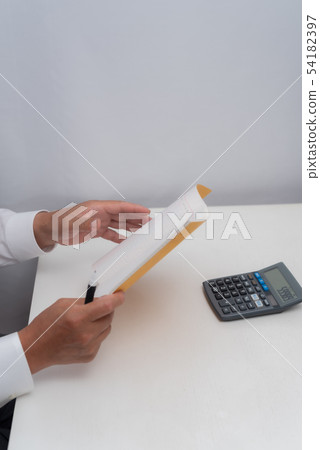 Senior man holding books Senior man holding books 54182397