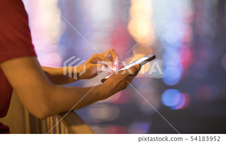 Hands pointing finger on smartphone screen at Hands pointing finger on smartphone screen at 54183952