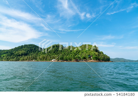 tropical island with ocean and blue sky tropical island with ocean and blue sky 54184180