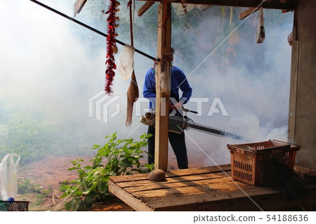 Staff are using fogging machine to spray fogging t 54188636