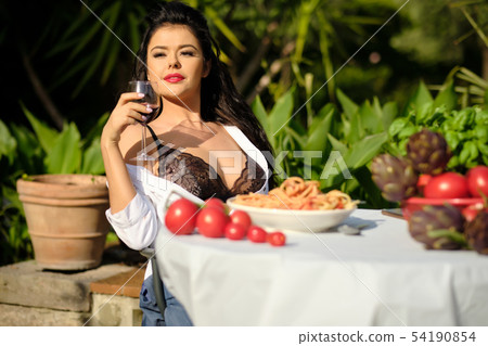 Vintage italian woman eating italian pasta with Vintage italian woman eating italian pasta with 54190854