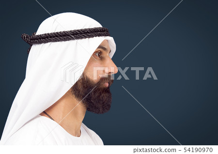 Arabian saudi businessman on dark blue studio background 54190970