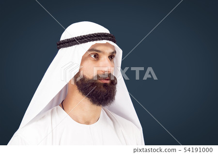 Arabian saudi businessman on dark blue studio background 54191000