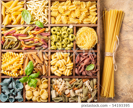 Assorted colorful italian pasta in wooden box Assorted colorful italian pasta in wooden box 54193395