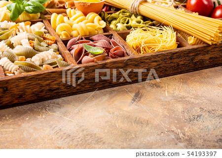 Assorted colorful italian pasta in wooden box Assorted colorful italian pasta in wooden box 54193397