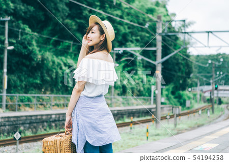 Travel image of a young woman Travel image of a young woman 54194258