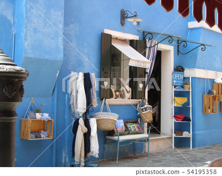 Beautiful blue house souvenir shop on Burano island in Venice Italy Beautiful blue house souvenir shop on Burano island in Venice Italy 54195358