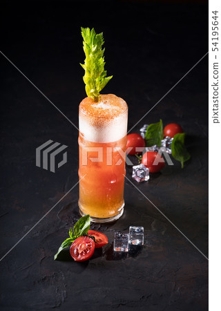 Bloody Mary Cocktail in glass with garnishes. Bloody Mary Cocktail in glass with garnishes. 54195644