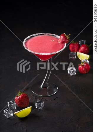 Glass of delicious strawberry daiquiri with lime Glass of delicious strawberry daiquiri with lime 54195650