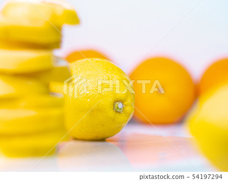 Set of oranges, yellow lemons and slices piled 54197294