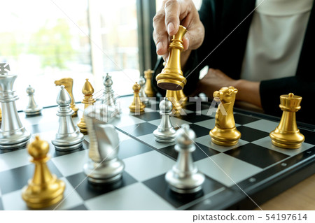 Businessman thinking and hold king chess on his 54197614